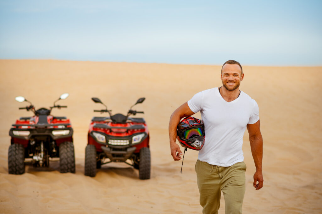 Two cars and a man with a helmet