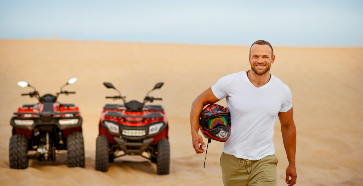 Two cars and a man with a helmet