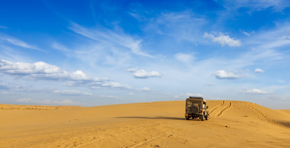 A car in the middle of the desert
