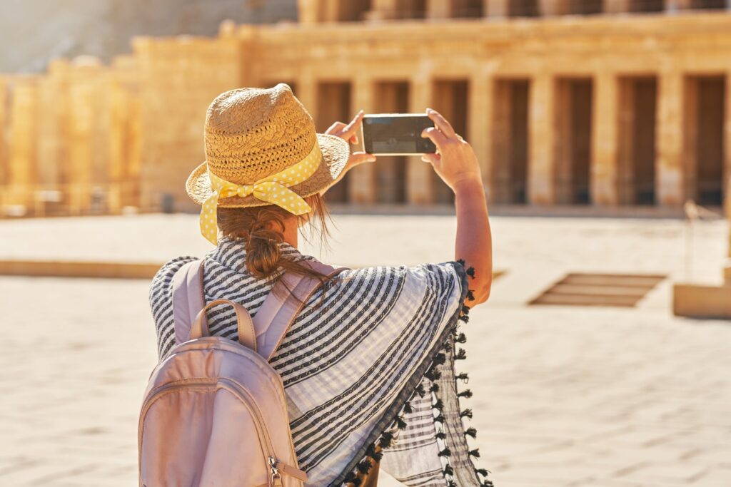 Girl taking souvenir photos